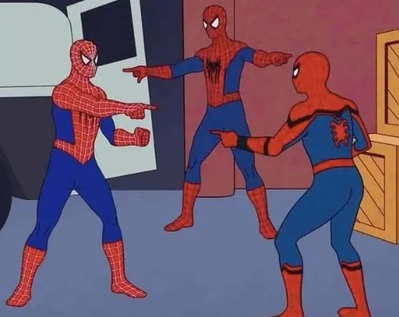 Two Spider-Man figures pointing at each other